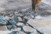 Jackhammer breaking up concrete, forging new paths